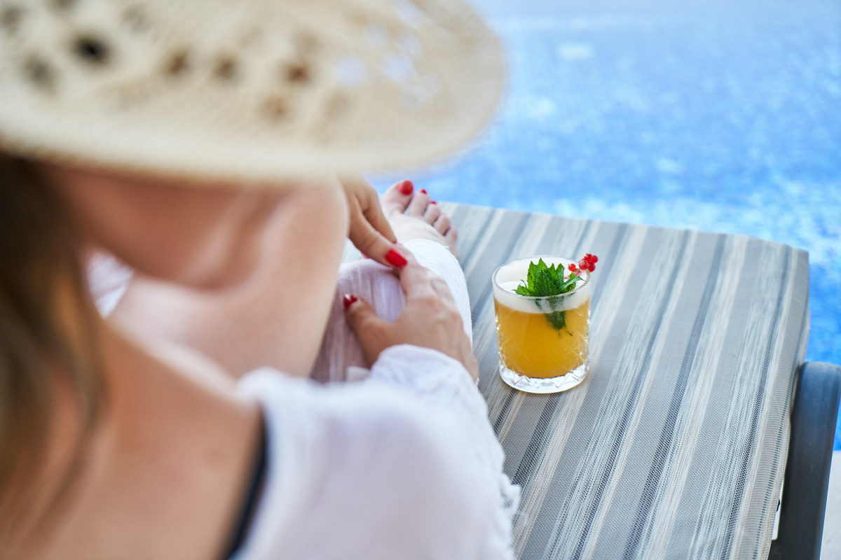 woman on vacation with a cocktail